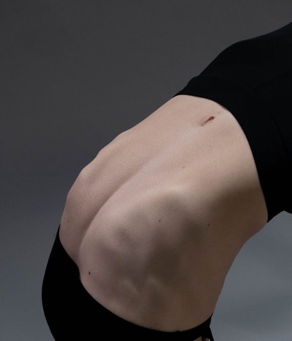 Woman in a calm yoga pose symbolizing inner balance and core strength.